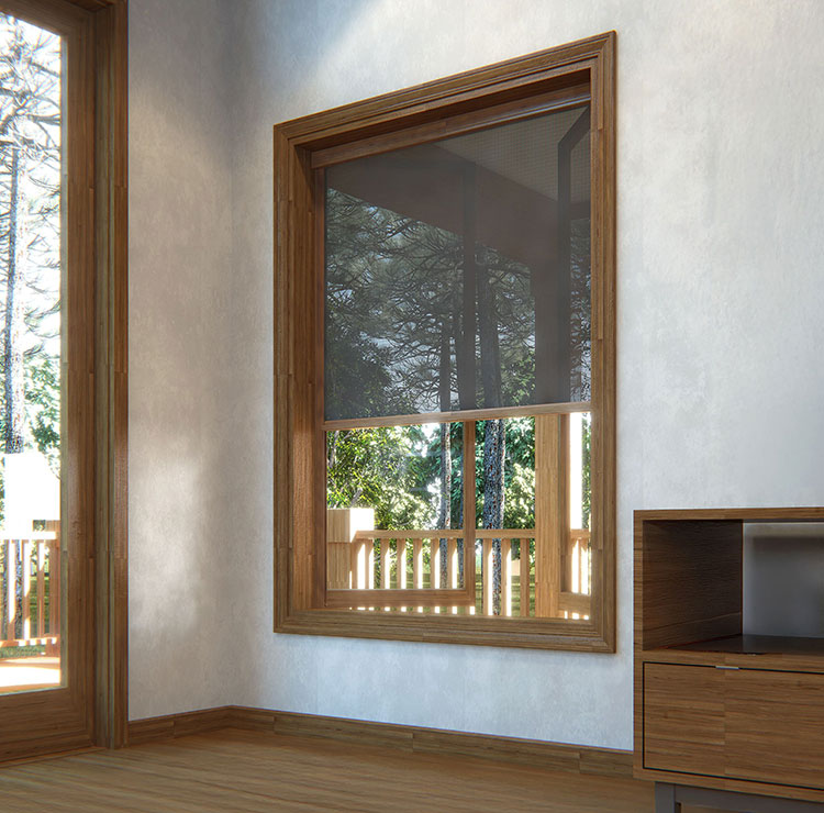 Bright room with wood-framed window and retractable screen, showcasing forest views through deck railing